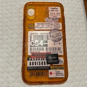 Orange iPhone XR phone case with stickers on the back